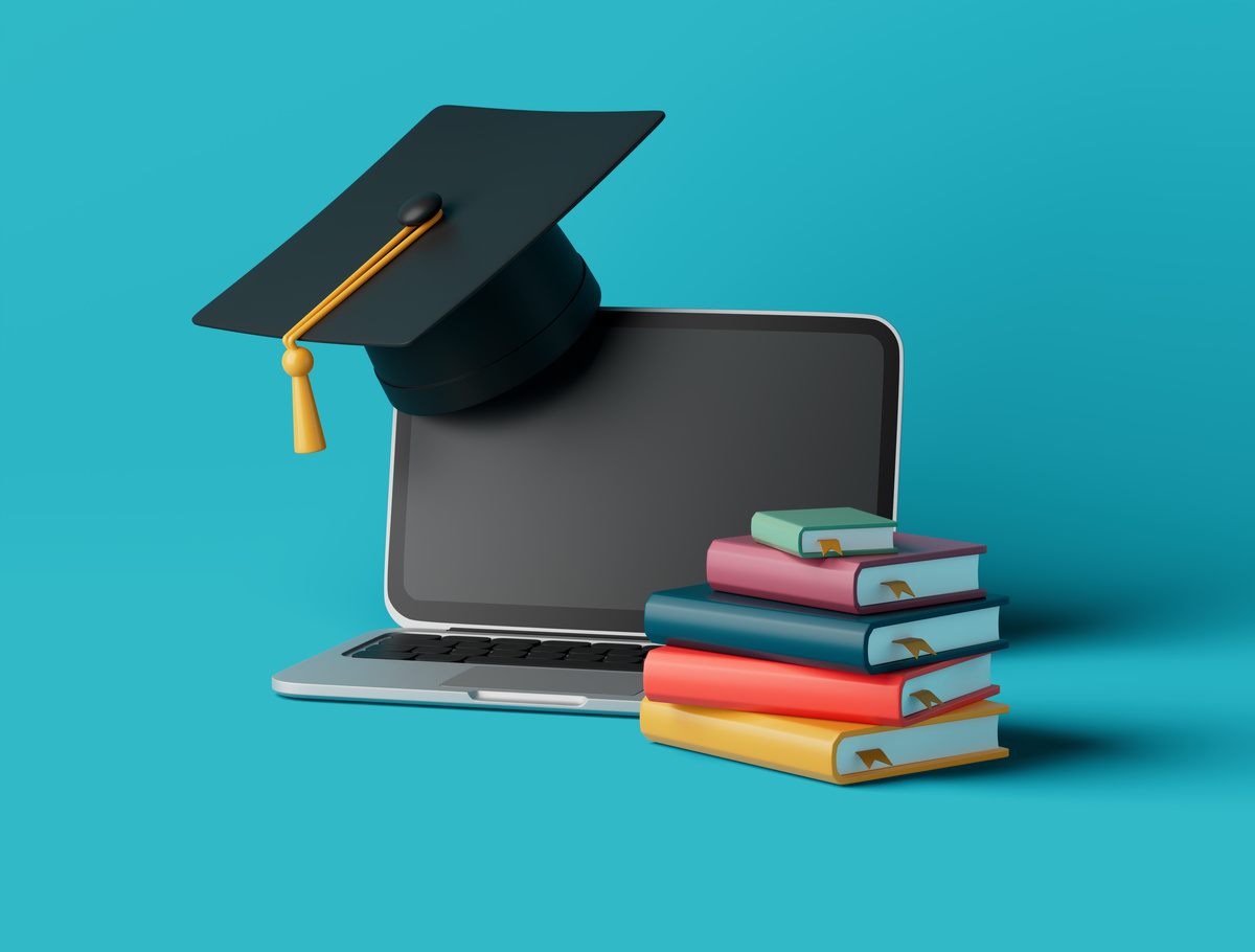 Simple online learning with books, graduation cup and laptop